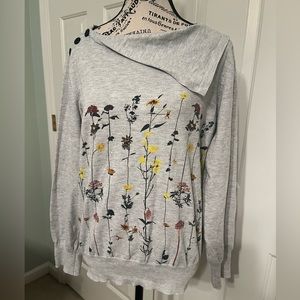 Women’s gray shirt with draped collar, faux buttons, and beautiful flowers